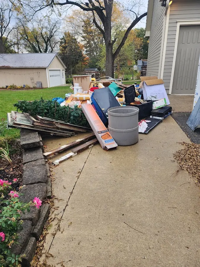 Dumpster being loaded with debris for 3 Yard Dumpster Rental in Highland Lakes